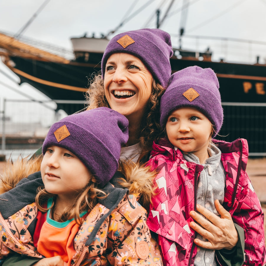 Familien aus unserer Community mit ihren Soulbuddy Caps & Beanies im Partnerlook